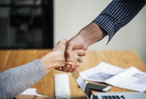 People shaking hands before college interview