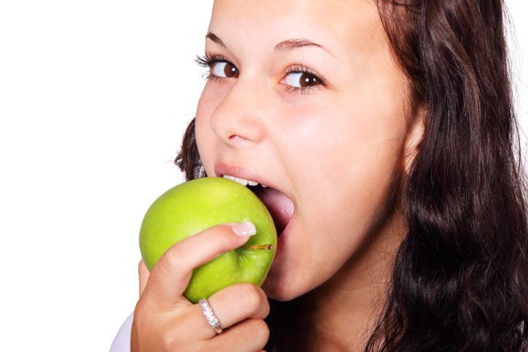 Girl eating an apple