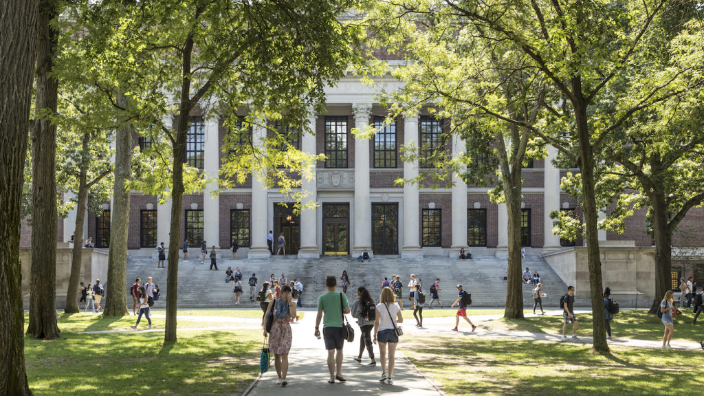 students in front of college building