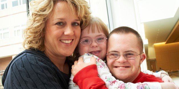 Mom and two kids with Downs syndrome