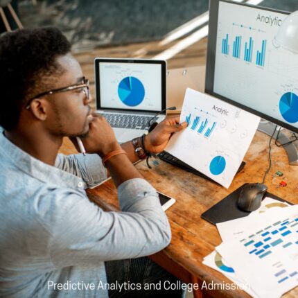 Man sitting at desk thoughtfully views computer screens and printouts labeled Analytics